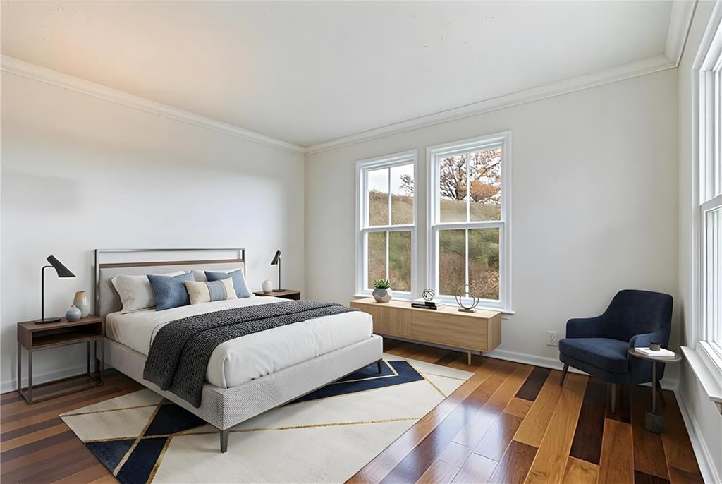 216 Lori Road Gibsonia, PA 15044 - Photo 8 of 50 This photo has been virtually staged to showcase the flexibility of converting this main-level space into a 5th bedroom. Positioned directly beside the powder room, adding a shower would be a straightforward enhancement for a true guest or in-law suite. Installing French doors would instantly create privacy while maintaining the natural light and architectural character of the room.