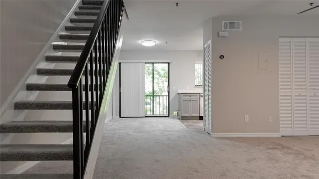 en view interior of a house with wooden floor and windows