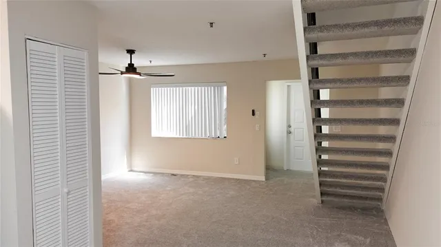 a view of an empty room with a window