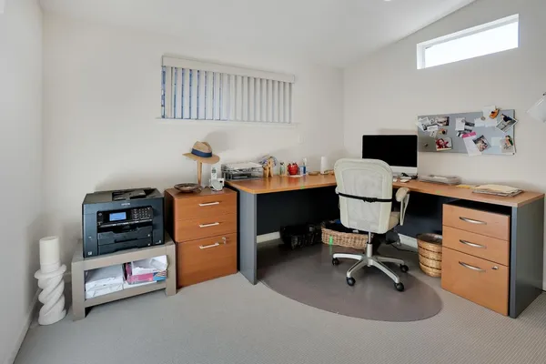 a bedroom with a workspace