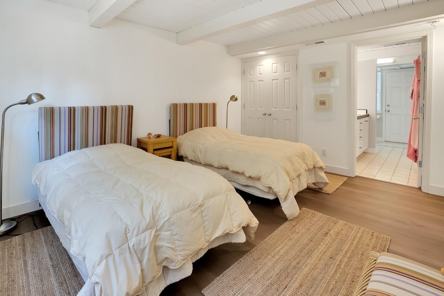 545 Beach Drive Aptos, CA 95003 - Photo 25 of 55 a spacious bedroom with two beds and wooden floor