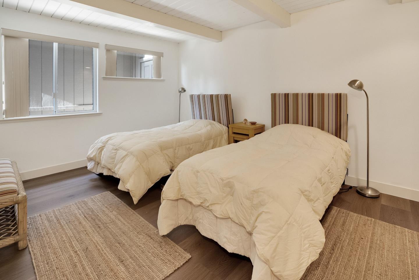 545 Beach Drive Aptos, CA 95003 - Photo 26 of 55 a bedroom with two beds and wooden floor