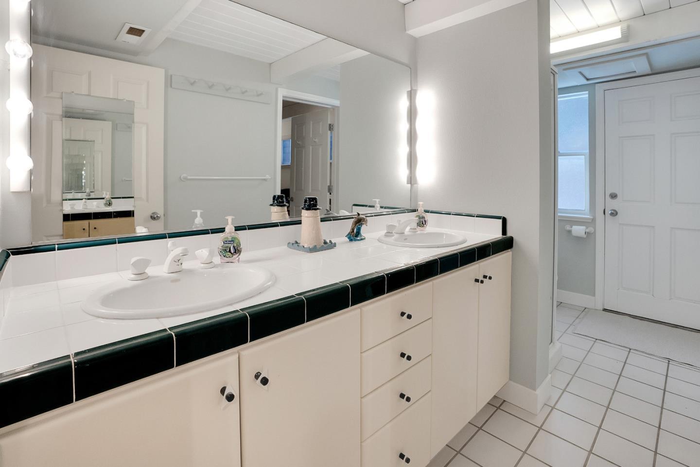 545 Beach Drive Aptos, CA 95003 - Photo 28 of 55 a bathroom with a sink and a mirror