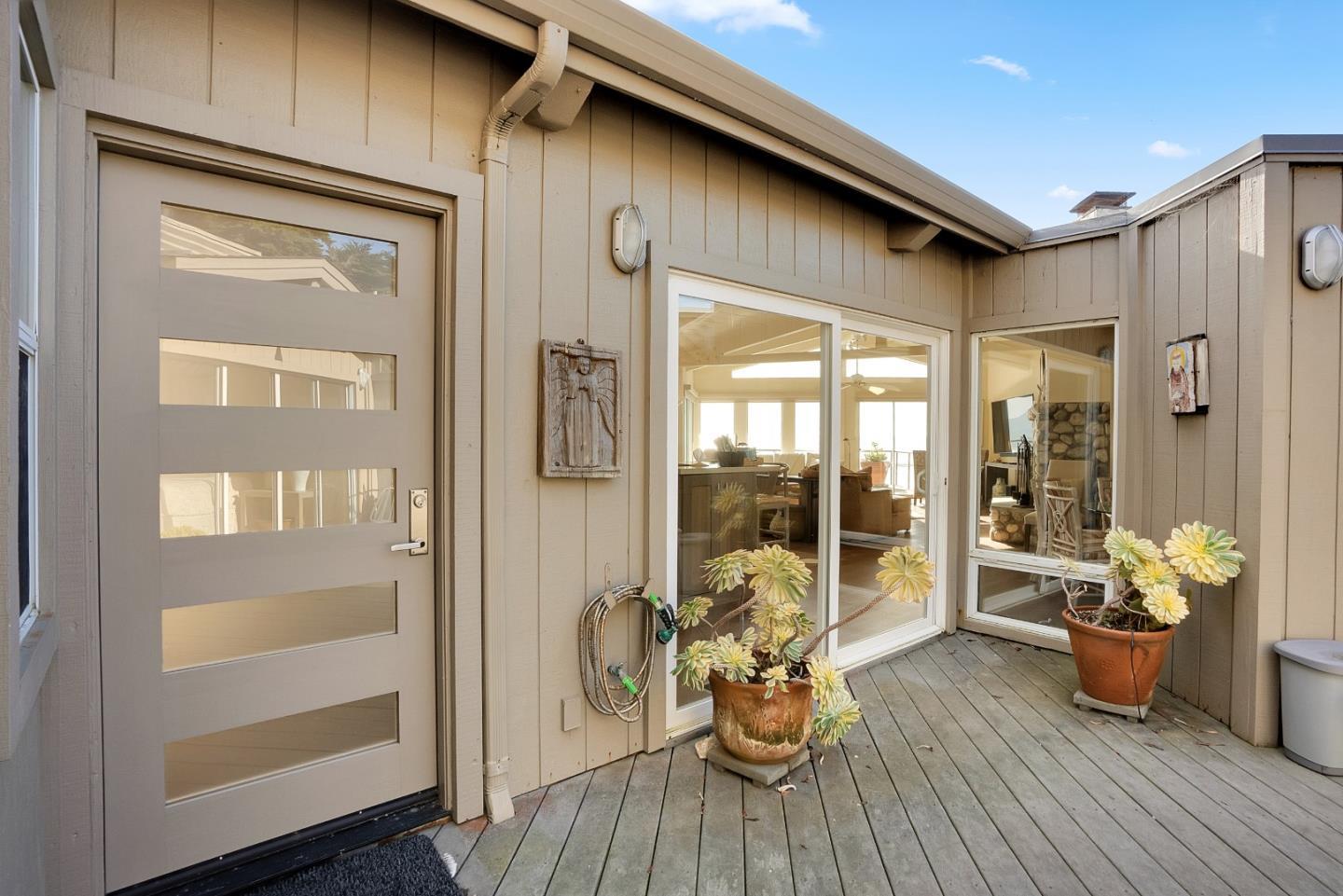 545 Beach Drive Aptos, CA 95003 - Photo 38 of 55 a dining room with wooden floor and a potted plant