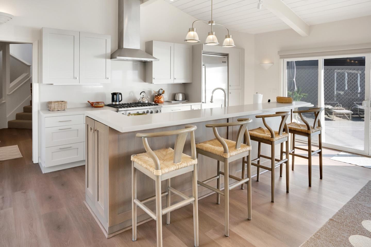 545 Beach Drive Aptos, CA 95003 - Photo 41 of 55 a kitchen with stainless steel appliances a dining table chairs and wooden floor