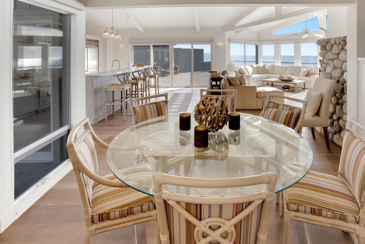 545 Beach Drive Aptos, CA 95003 - Photo 42 of 55 a dining room with furniture a chandelier and wooden floor