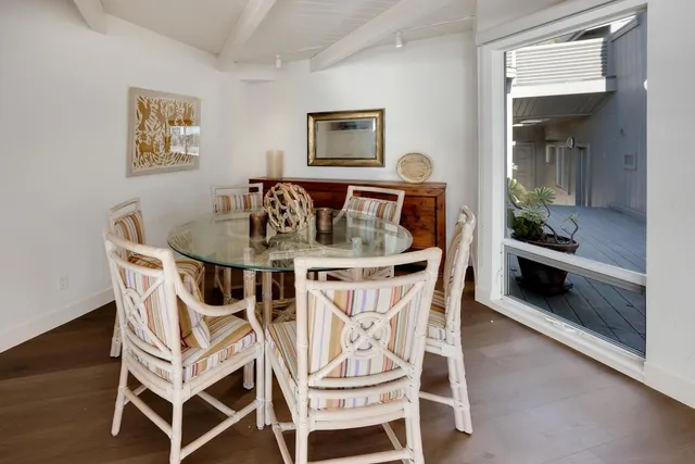 a large kitchen with lots of counter top space and stainless steel appliances