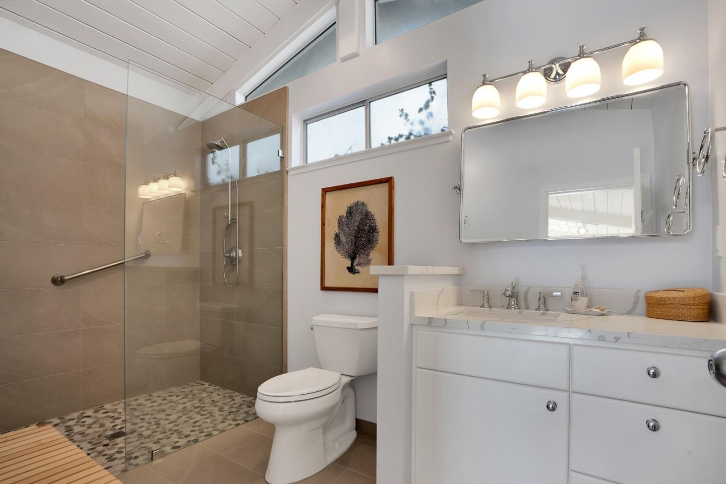 545 Beach Drive Aptos, CA 95003 - Photo 50 of 55 a bathroom with a sink a toilet a shower and a mirror