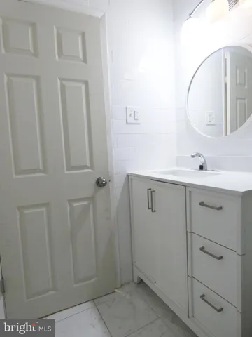 a bedroom with a bed and a lamp