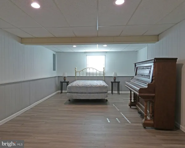 a workspace with furniture window and wooden floor