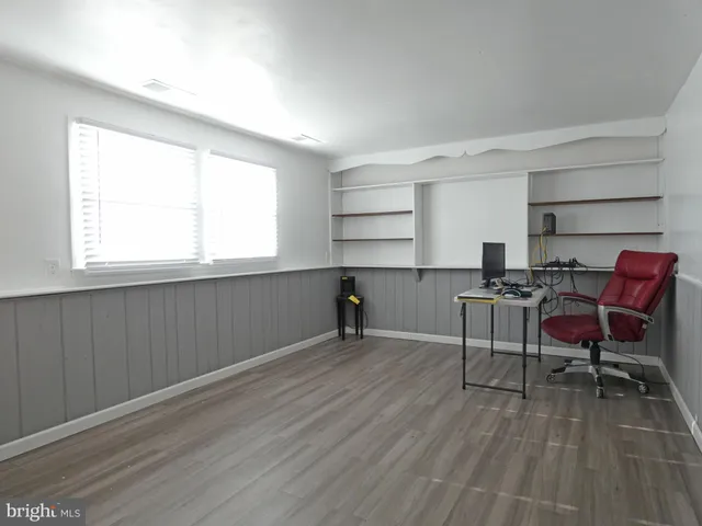 a view of a livingroom with wooden floor