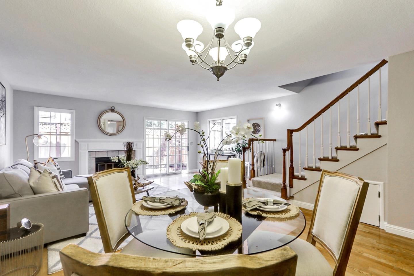 191 Redding Road Campbell, CA 95008 - Photo 18 of 37 a view of a dining room with furniture a chandelier and wooden floor