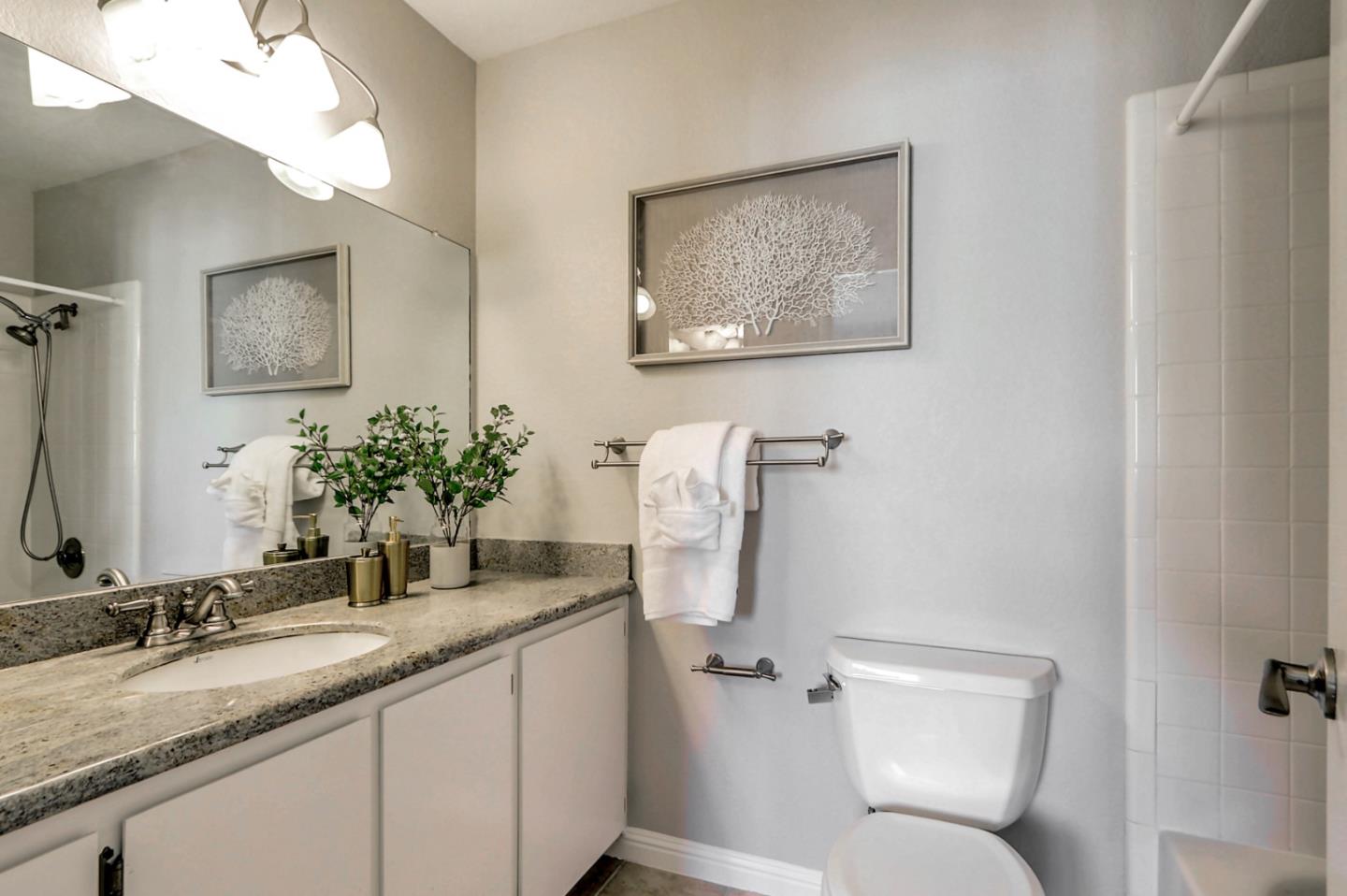 191 Redding Road Campbell, CA 95008 - Photo 30 of 37 a bathroom with a granite countertop sink toilet and a mirror