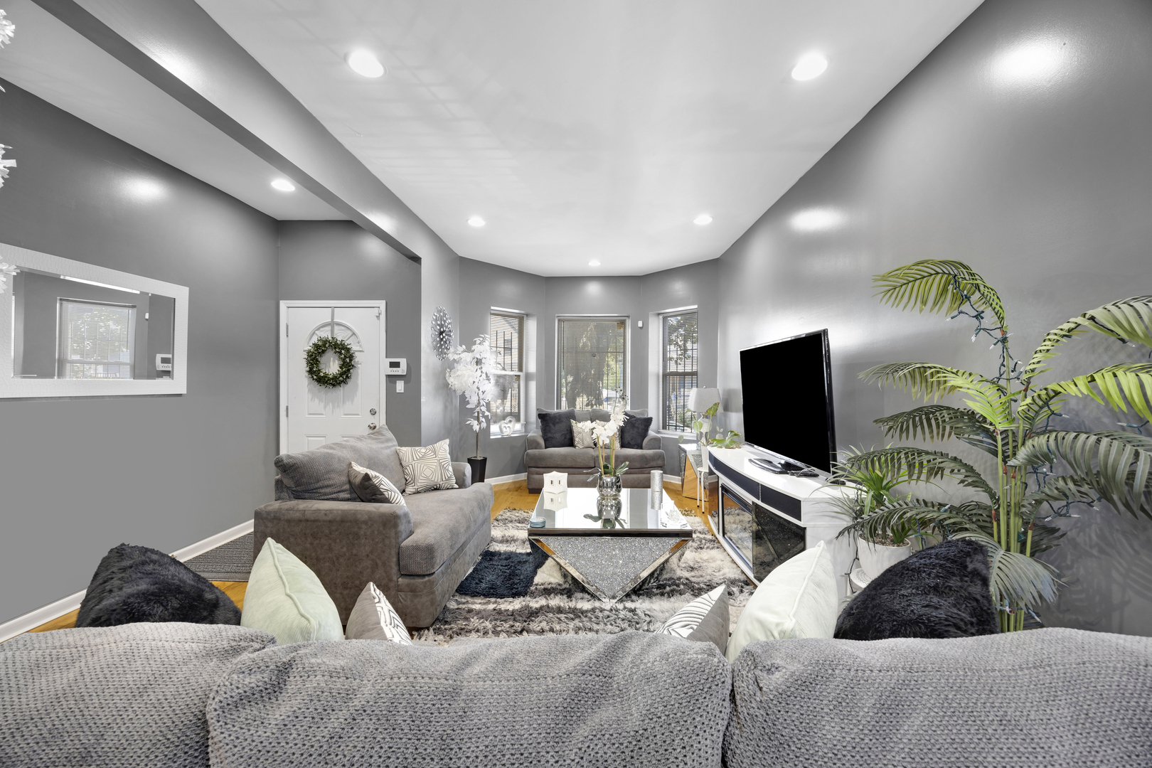 7220 South Carpenter Street Chicago, IL 60621 - Photo 9 of 17 a living room with furniture and a flat screen tv