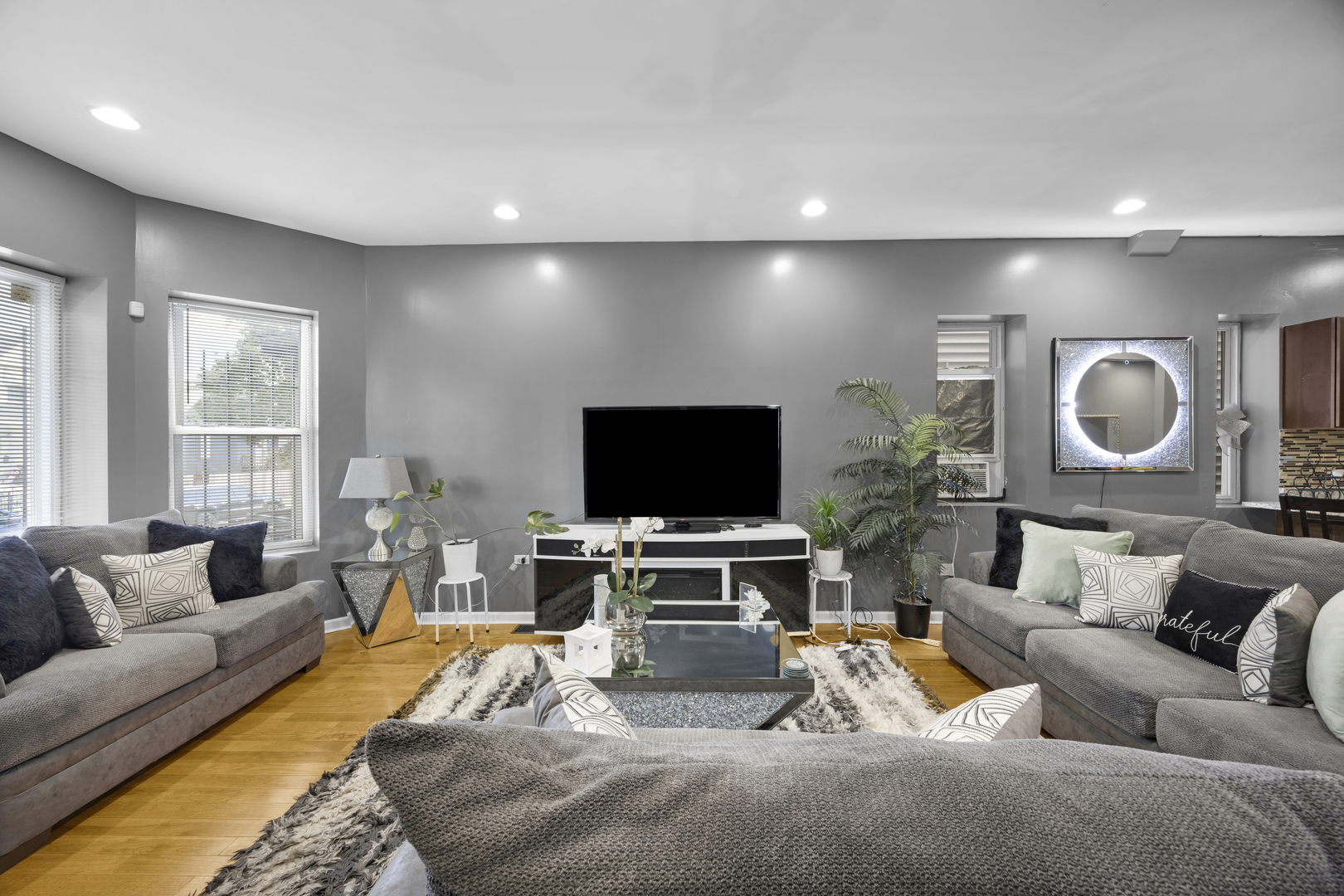 7220 South Carpenter Street Chicago, IL 60621 - Photo 10 of 17 a living room with furniture and a flat screen tv