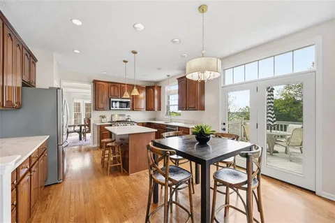 a kitchen with a table and chairs in it