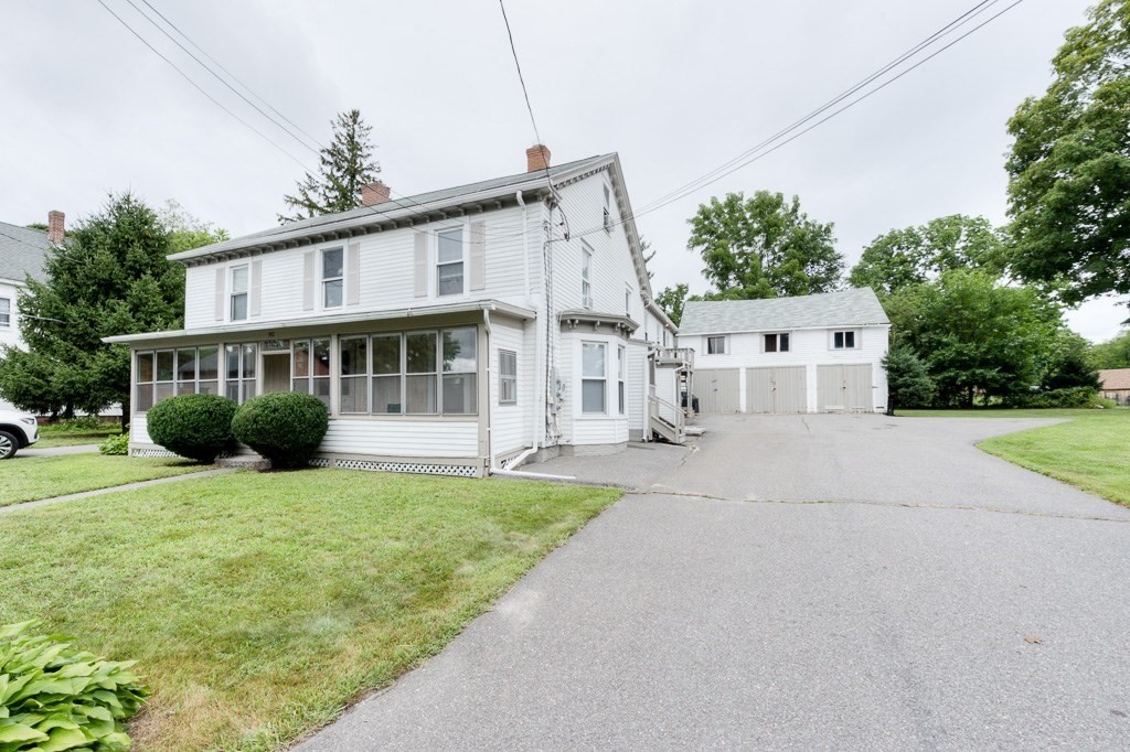 92 Mill Street Lancaster, MA 01523 - Photo 1 of 42 a view of house with yard and green space
