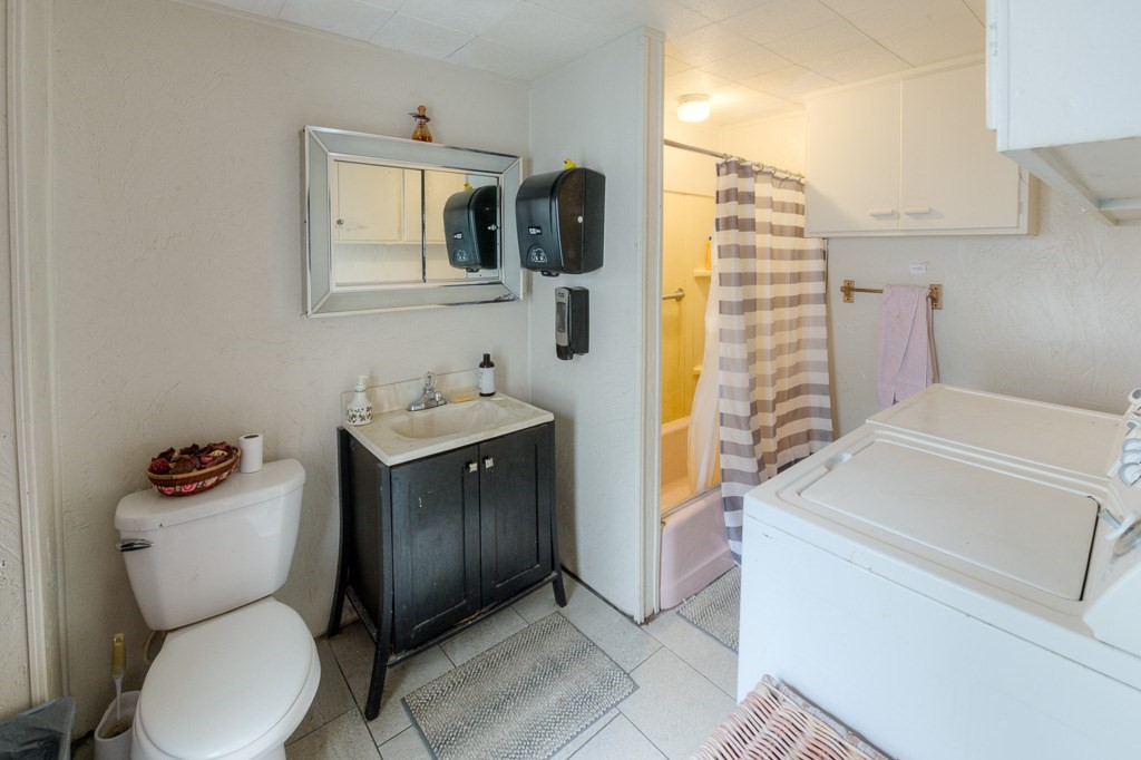92 Mill Street Lancaster, MA 01523 - Photo 16 of 42 a bathroom with a toilet sink and mirror