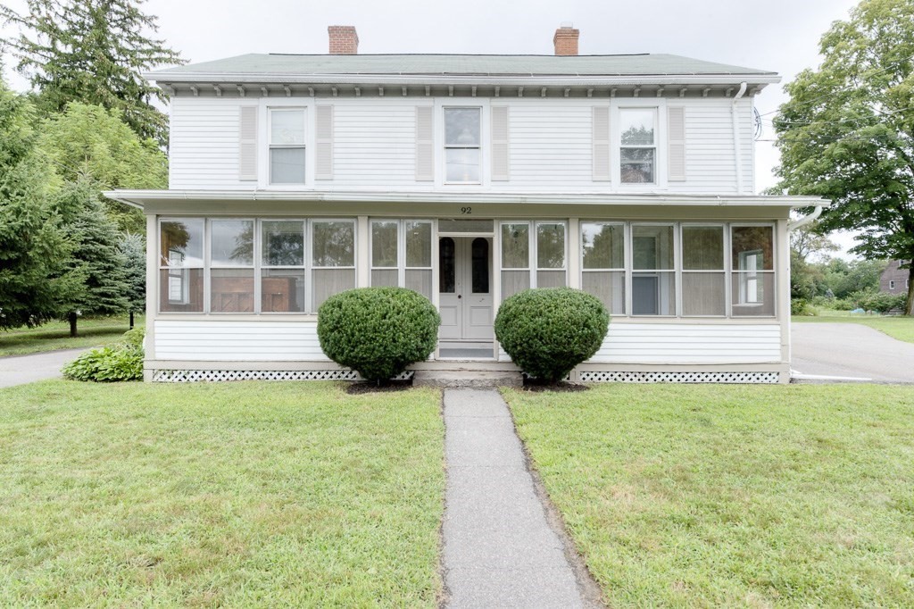 92 Mill Street Lancaster, MA 01523 - Photo 2 of 42 a front view of a house with garden