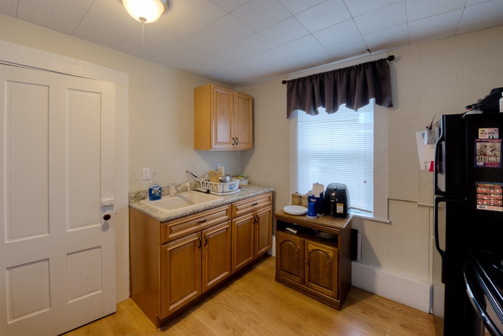 92 Mill Street Lancaster, MA 01523 - Photo 25 of 42 a kitchen with a stove and a refrigerator