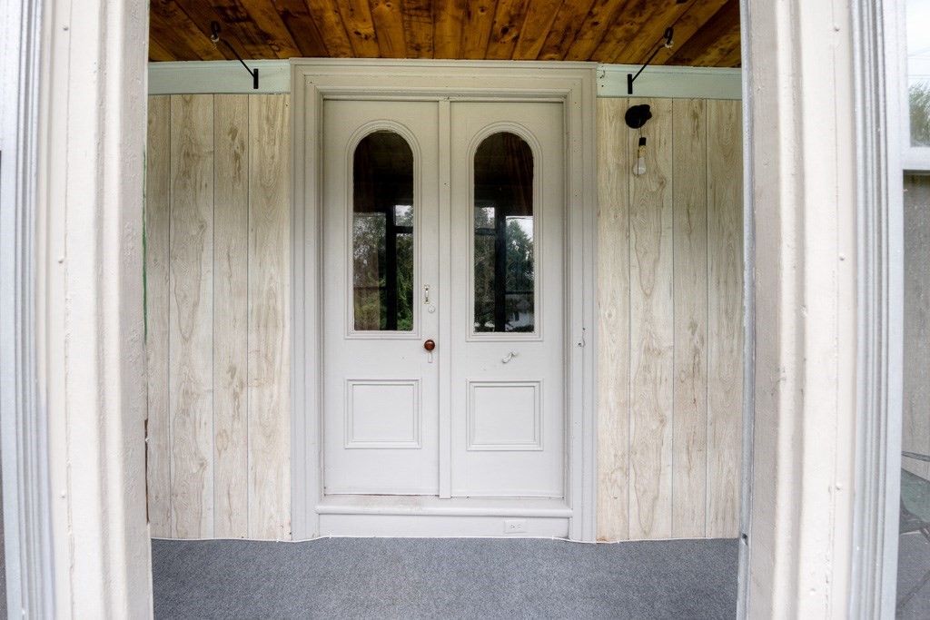 92 Mill Street Lancaster, MA 01523 - Photo 3 of 42 a view of a door with wooden door