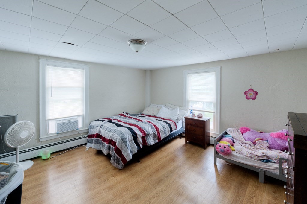 92 Mill Street Lancaster, MA 01523 - Photo 31 of 42 a bedroom with a bed and a window