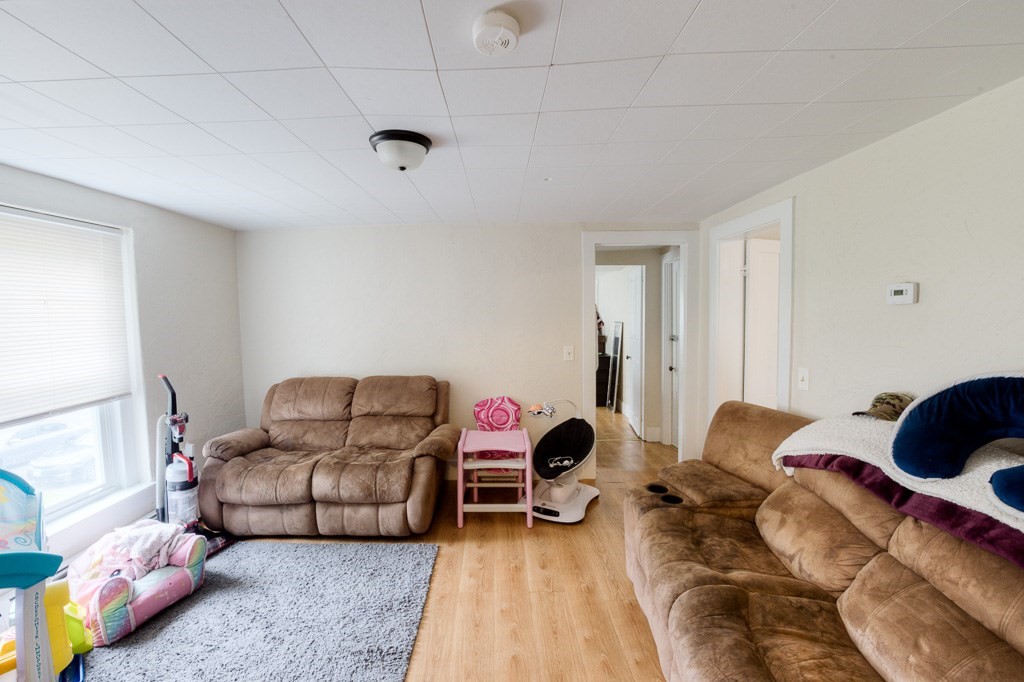 92 Mill Street Lancaster, MA 01523 - Photo 33 of 42 a bedroom with furniture and a window