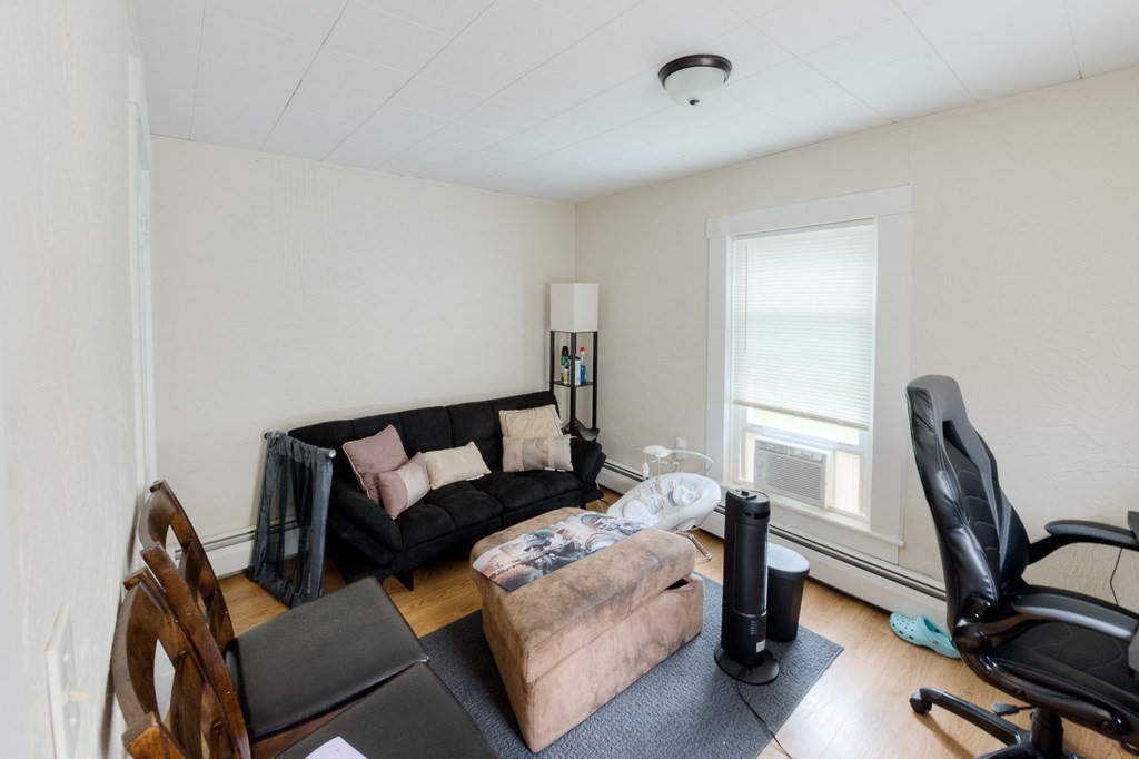 92 Mill Street Lancaster, MA 01523 - Photo 34 of 42 a bed room with furniture and a window