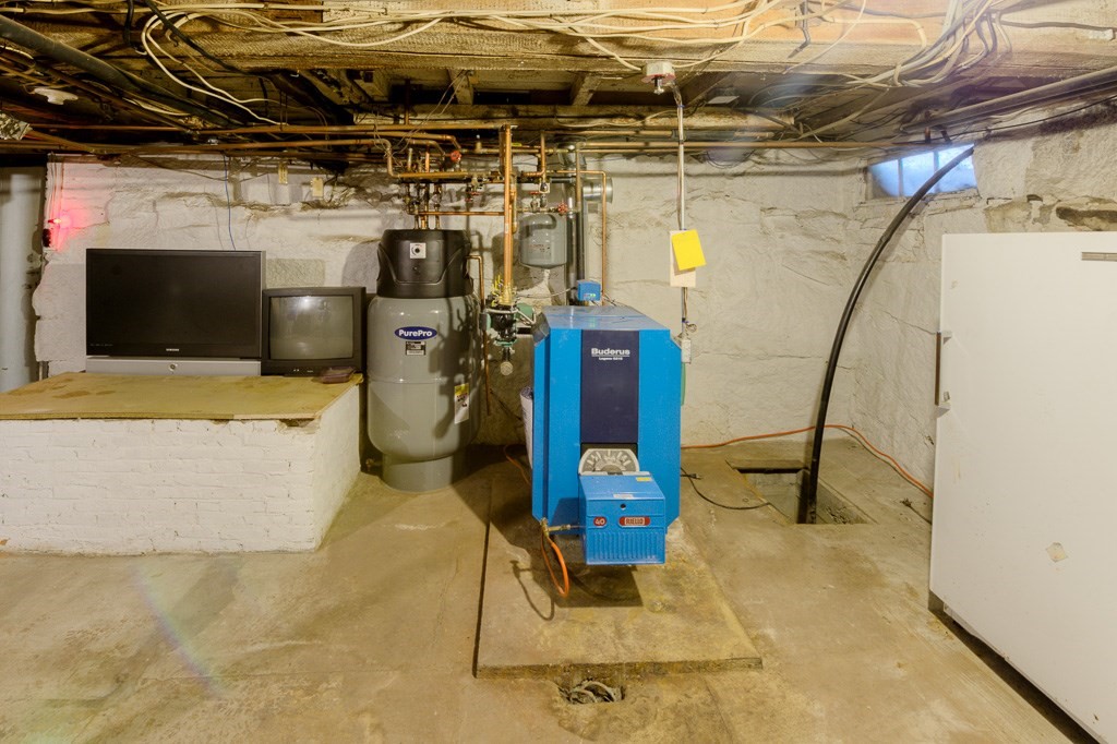 92 Mill Street Lancaster, MA 01523 - Photo 35 of 42 a view of a storage room
