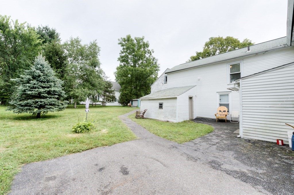 92 Mill Street Lancaster, MA 01523 - Photo 40 of 42 a view of a house with backyard and trees