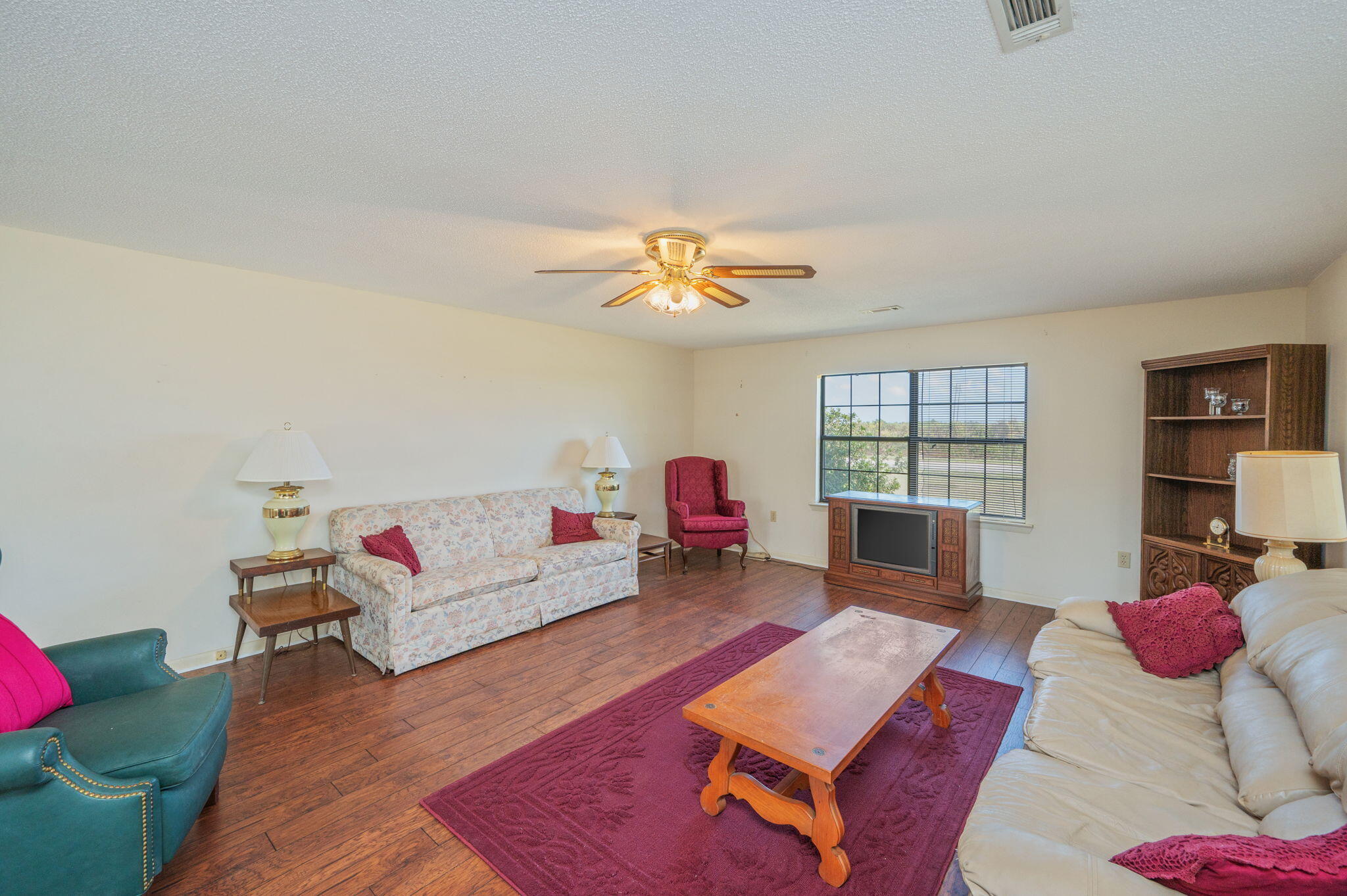 1950 Prescott Road Florala, AL 36442 - Photo 12 of 56 a living room with furniture and a rug