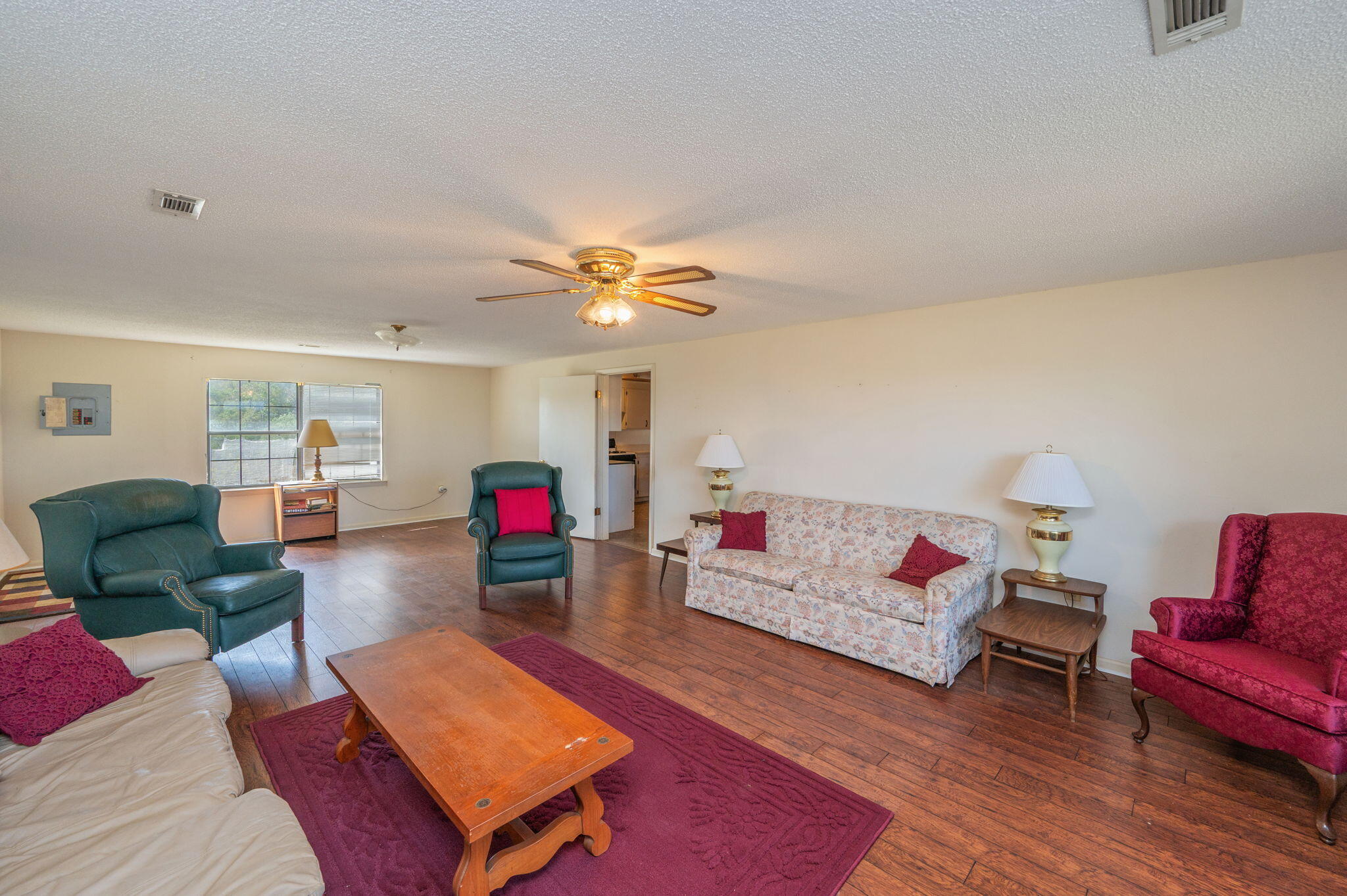 1950 Prescott Road Florala, AL 36442 - Photo 15 of 56 a living room with furniture and wooden floor