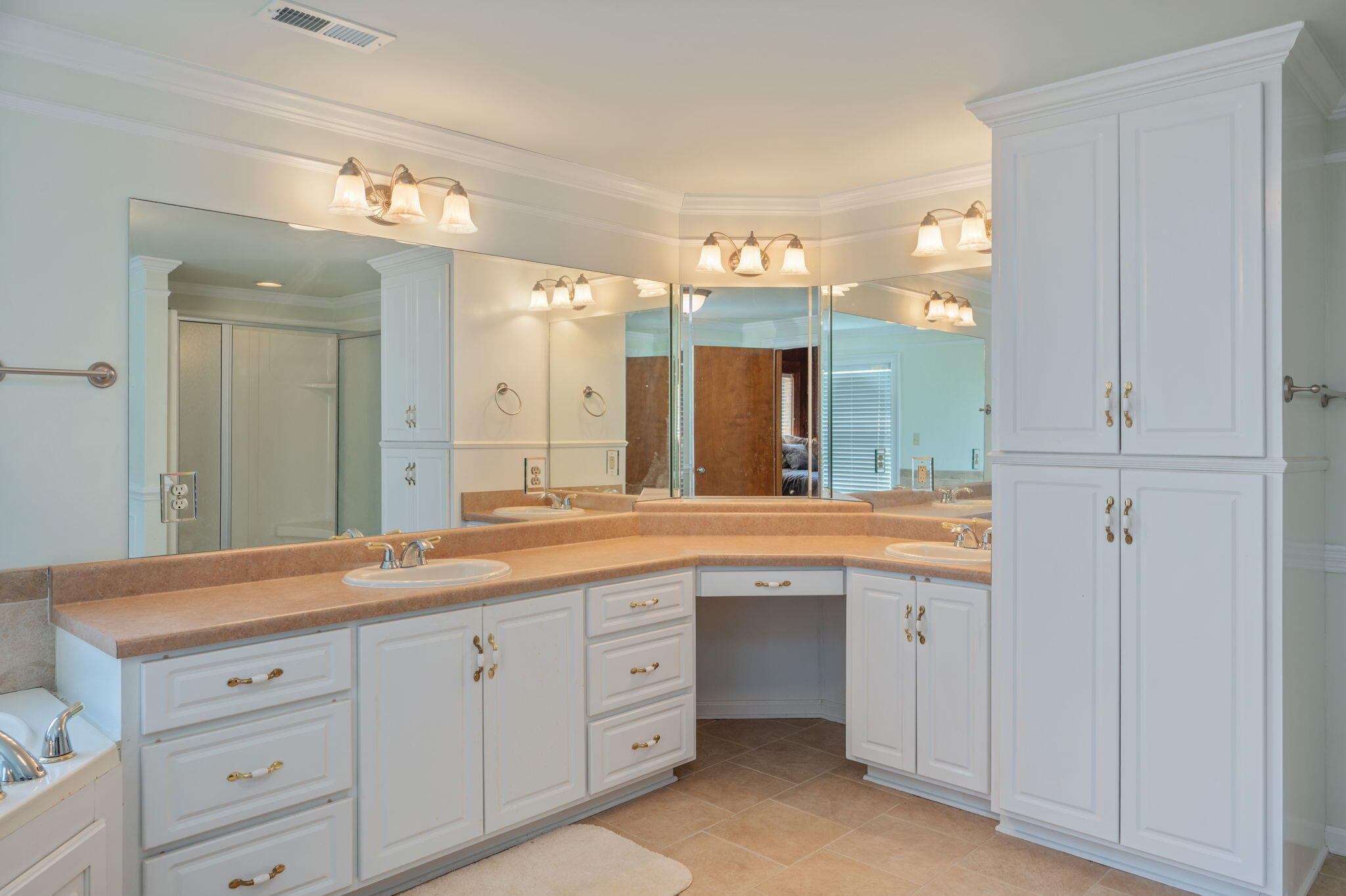 1950 Prescott Road Florala, AL 36442 - Photo 26 of 56 a spacious bathroom with a granite countertop sink and mirror