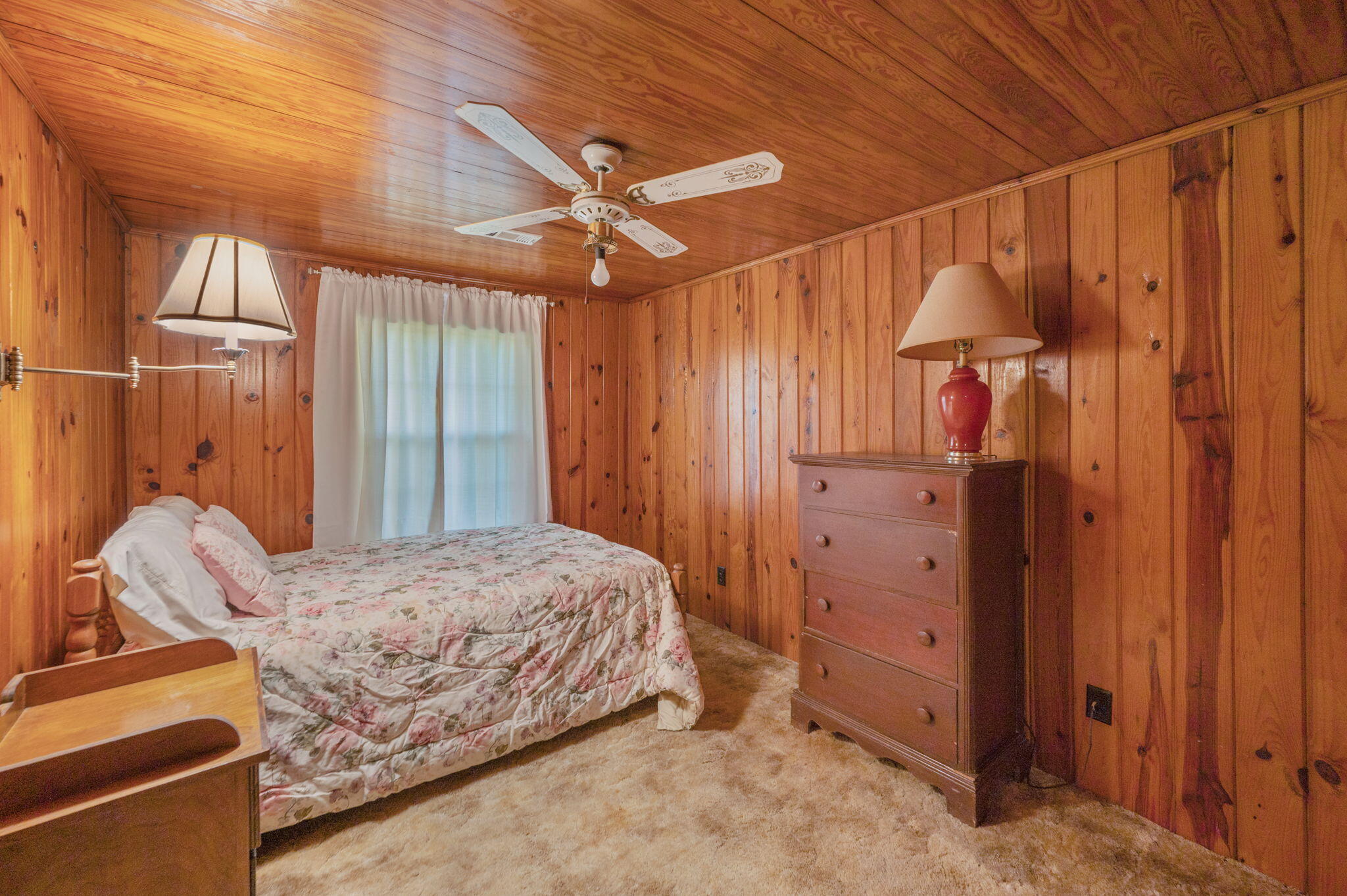 1950 Prescott Road Florala, AL 36442 - Photo 30 of 56 a bedroom with a bed and a chandelier