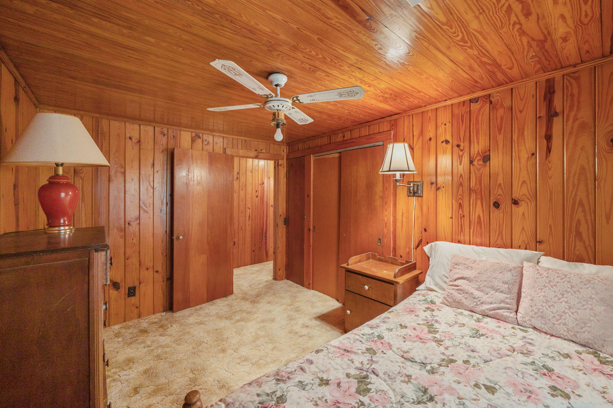 1950 Prescott Road Florala, AL 36442 - Photo 31 of 56 a bedroom with a bed and a chandelier