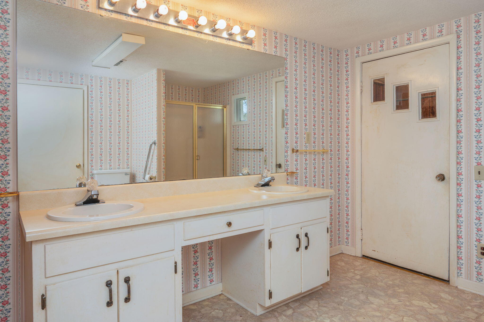 1950 Prescott Road Florala, AL 36442 - Photo 32 of 56 a bathroom with a sink a vanity and a mirror