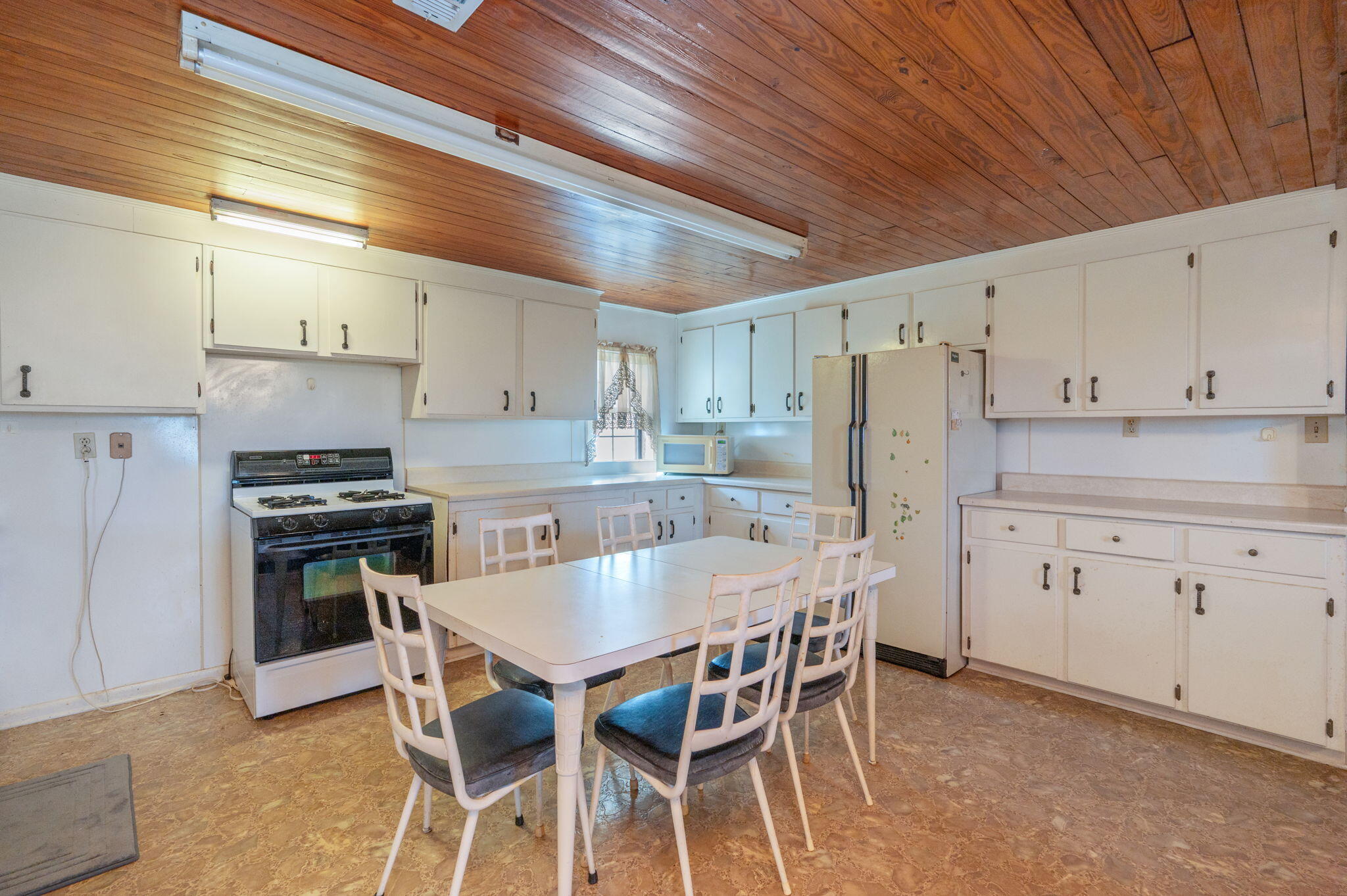 1950 Prescott Road Florala, AL 36442 - Photo 5 of 56 a kitchen with granite countertop a center island stainless steel appliances and cabinets