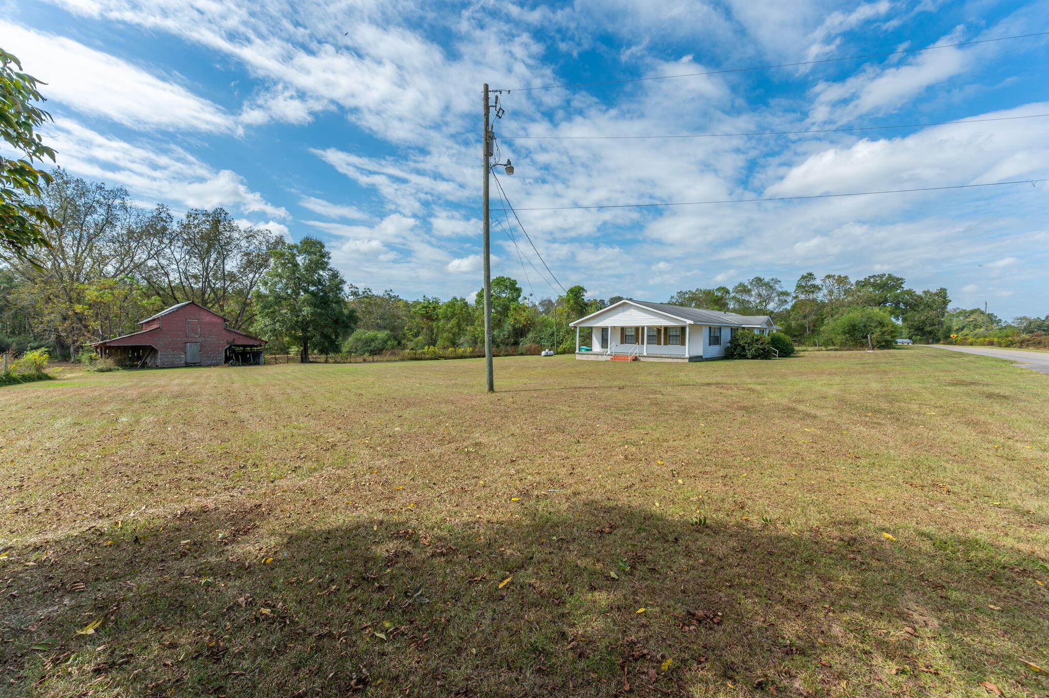 1950 Prescott Road Florala, AL 36442 - Photo 52 of 56 a view of a field with an trees in the background