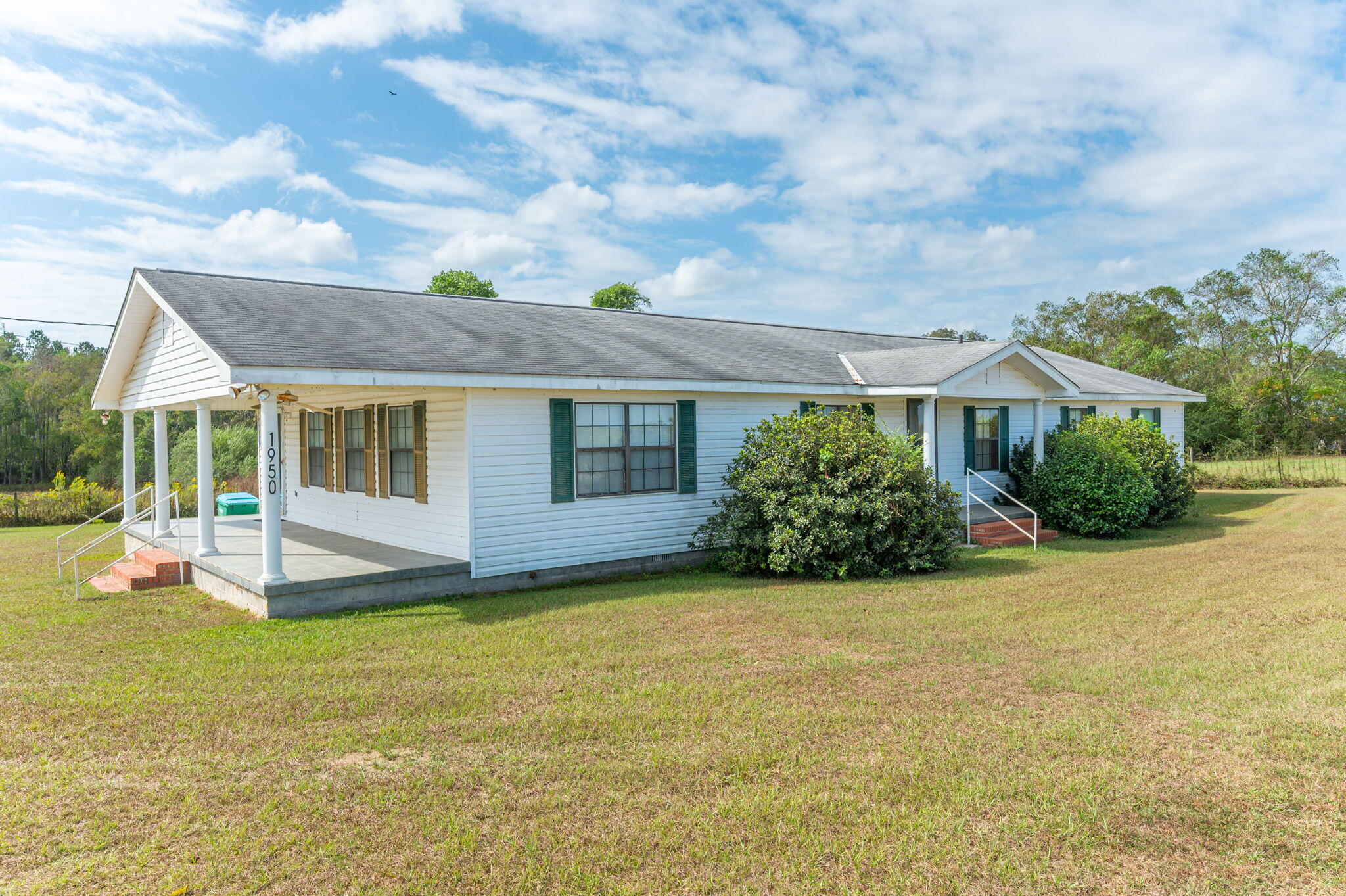 1950 Prescott Road Florala, AL 36442 - Photo 54 of 56 a view of a house with backyard porch and sitting area