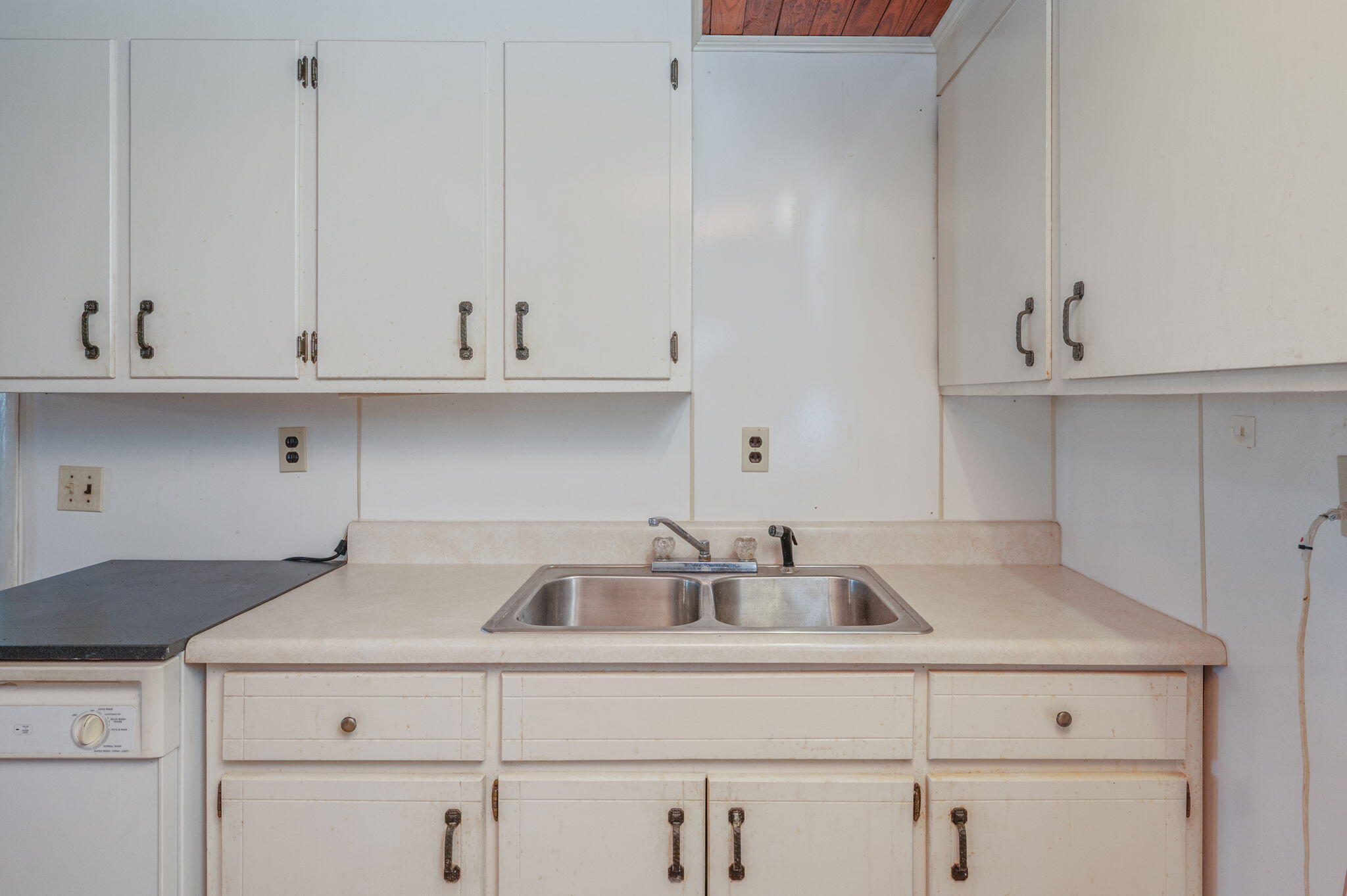 1950 Prescott Road Florala, AL 36442 - Photo 6 of 56 a kitchen with white cabinets and a sink