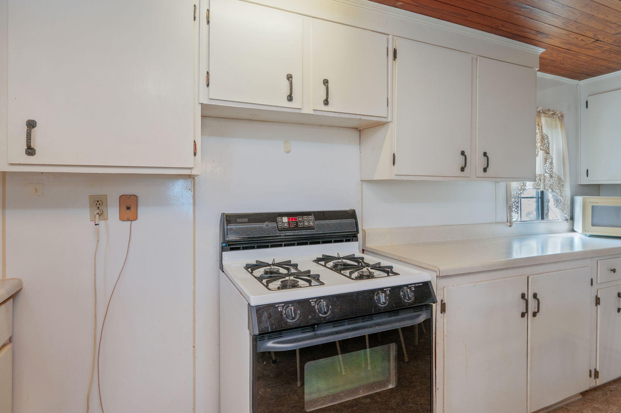 1950 Prescott Road Florala, AL 36442 - Photo 7 of 56 a kitchen with stainless steel appliances granite countertop a stove and a refrigerator