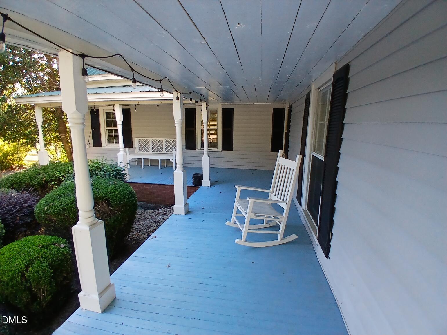 1920 Kelly Road Apex, NC 27502 - Photo 9 of 44 a view of a porch with furniture and wooden floor