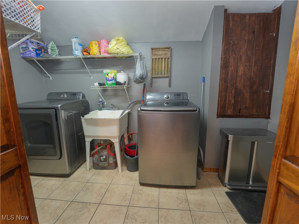 2399 Columbiana Road New Springfield, OH 44443 - Photo 8 of 38 Laundry room off kitchen with ceramic tile floors