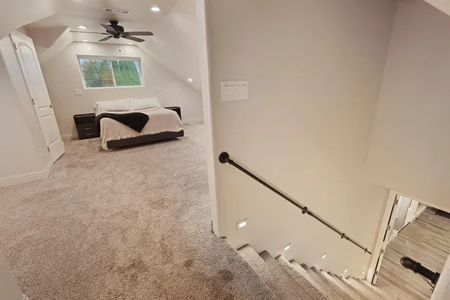 a bathroom with a window and a bathtub