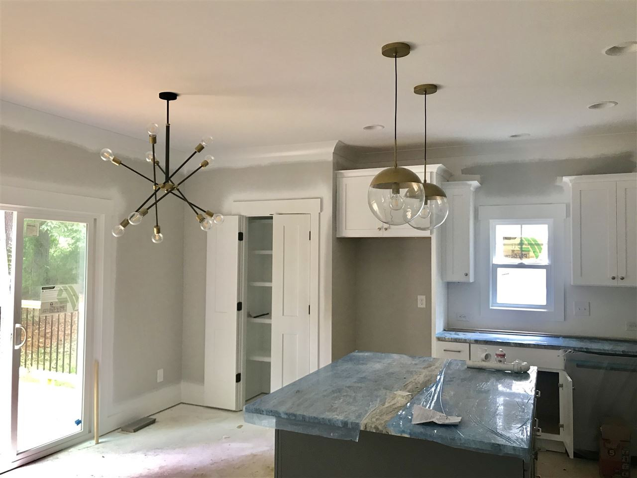 1320 Foxrun Drive Raleigh, NC 27610 - Photo 3 of 24 Nice size kitchen w/ large island. Under cabinet lighting and modern light fixtures. SS Gas Range, Microwave & Dishwasher. Granite Countertops. Engineered Hardwood Floors. Kitchen/Breakfast