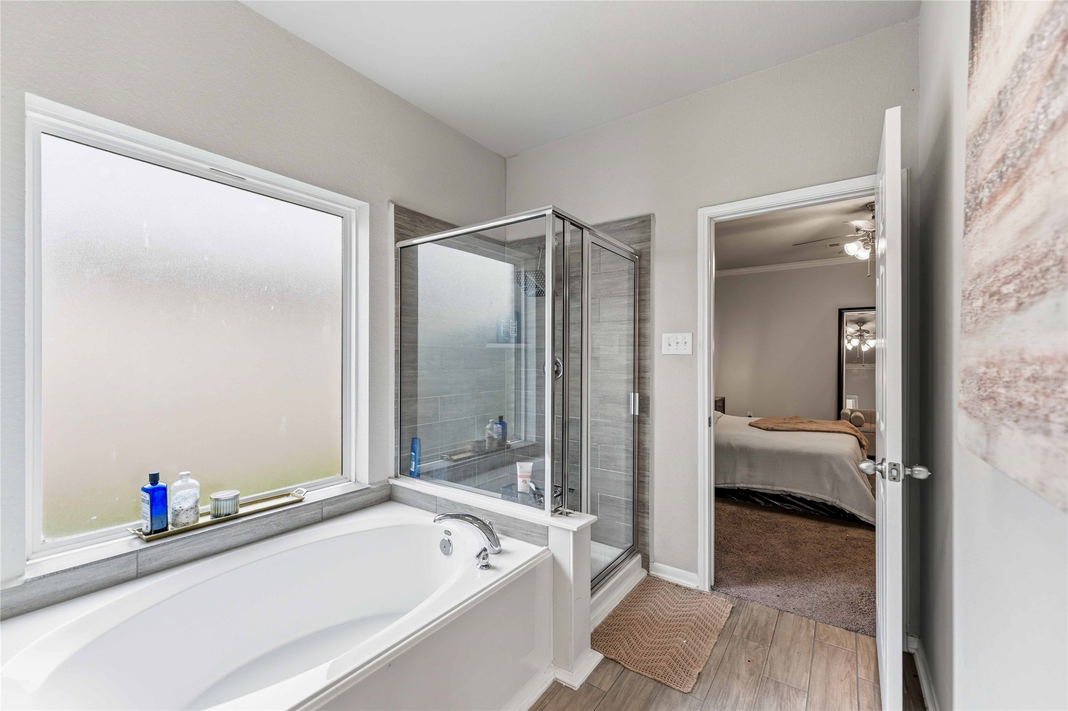 14810 Ruddy Duck Lane Houston, TX 77049 - Photo 16 of 33 a bathroom with a tub and a shower