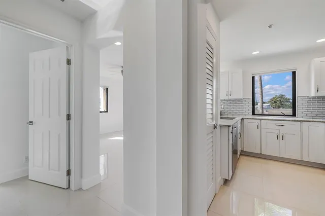 a view of a kitchen with a sink