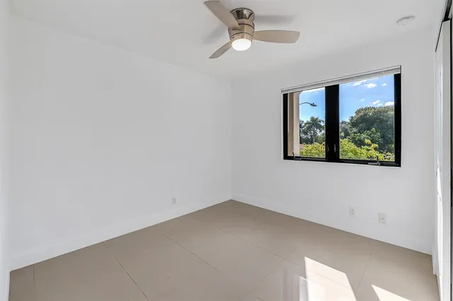 a bathroom with a granite countertop sink toilet and bathtub