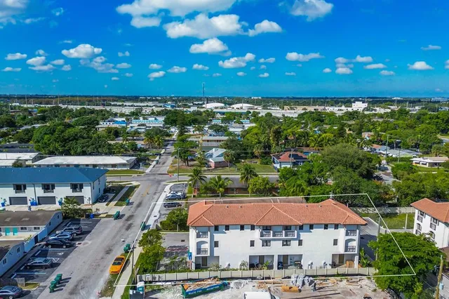 a front view of a building with lot of traffic signal lights