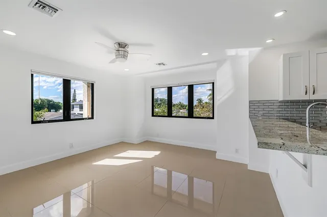 a view of a kitchen with a dishwasher and cabinets
